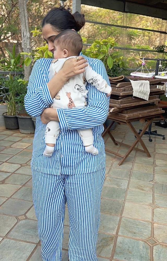Sonam Kapoor can be seen cuddling her son